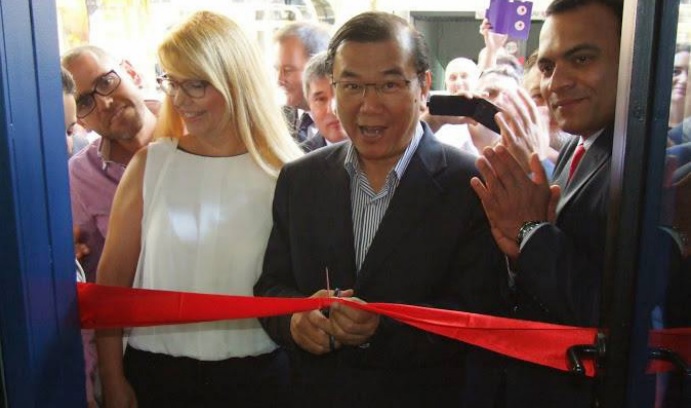 DXN Spain office opening with dr. Lim cutting the red ribbon