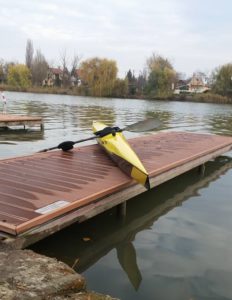 Yellow K1 kayak on pier at Csepel Island, Budapest, Hungary