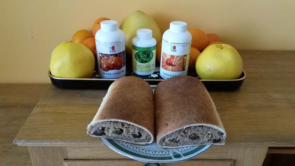 Acidic and alkaline food: DXN products and traditional Hungarian cake: beige stuffed with nuts.