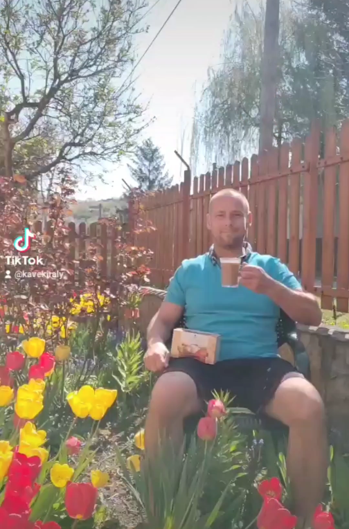 Drinking DXN Ganoderma coffee among tulips in the Garden of the CoffeeKing